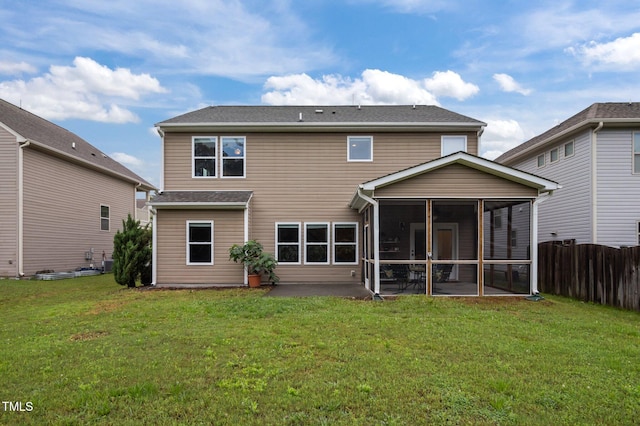 rear view of house with a sunroom and a patio area