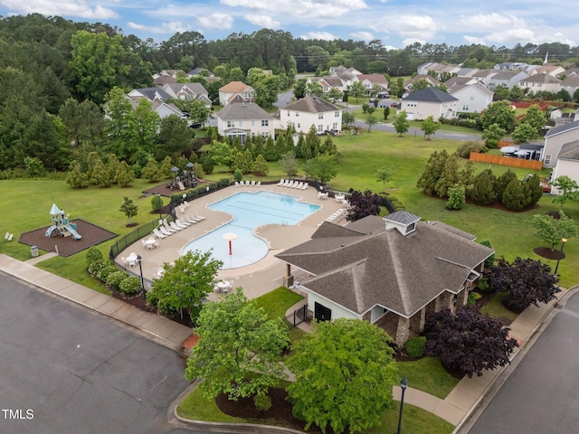 aerial view of residential area with a pool area