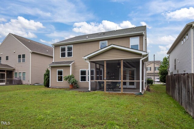 back of house featuring a sunroom
