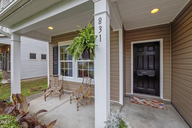 doorway to property with covered porch