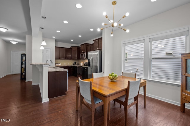 dining area featuring baseboards, a chandelier, dark wood-type flooring, and recessed lighting