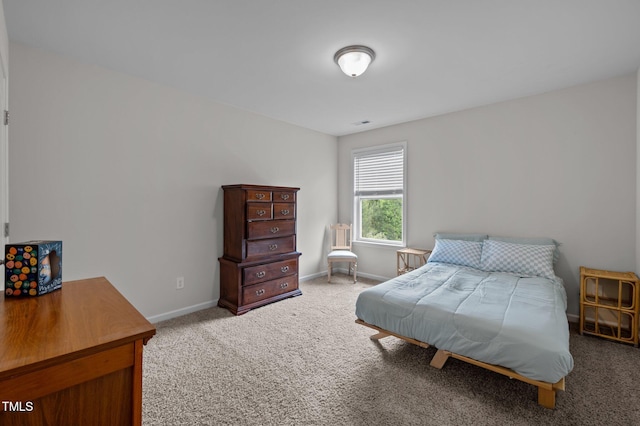 carpeted bedroom with baseboards