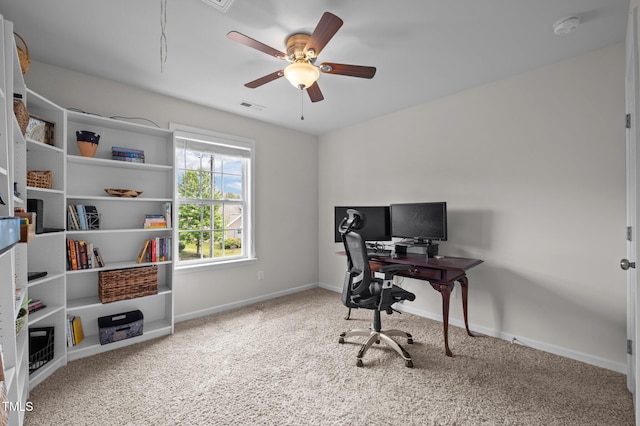 office space featuring carpet flooring, baseboards, and a ceiling fan