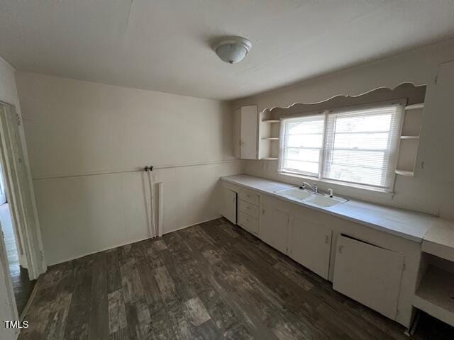 246 Keene St, Henderson, NC 27536 - kitchen with open shelves, a sink, dark wood-type flooring, light countertops, and white cabinetry