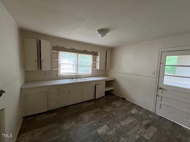 246 Keene St, Henderson, NC 27536 - kitchen featuring open shelves, dark wood-type flooring, plenty of natural light, and white cabinetry