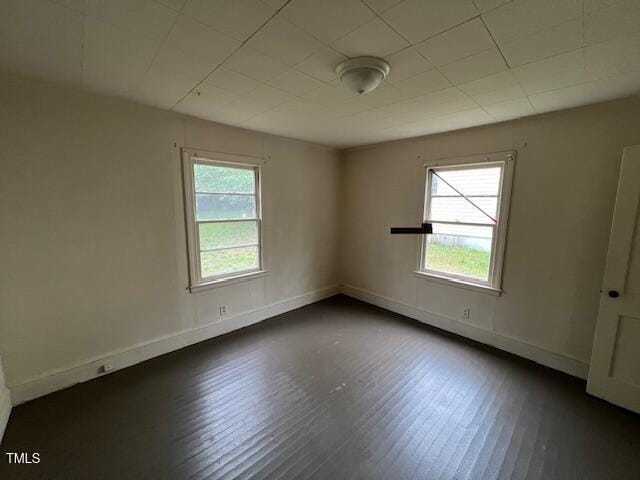 246 Keene St, Henderson, NC 27536 - spare room featuring dark wood finished floors and baseboards