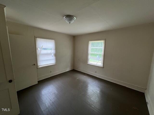 246 Keene St, Henderson, NC 27536 - empty room with dark wood-style flooring and baseboards