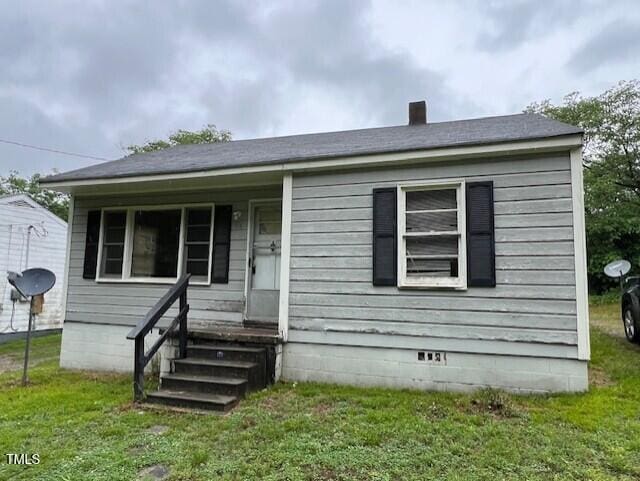 246 Keene St, Henderson, NC 27536 - bungalow-style house with a front yard and crawl space