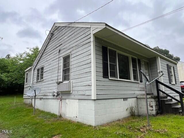 246 Keene St, Henderson, NC 27536 - view of property exterior with crawl space and a yard