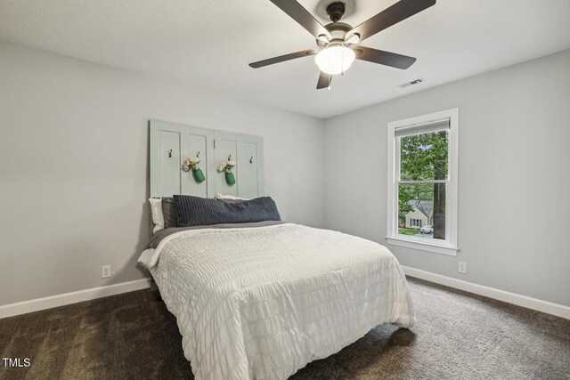 carpeted bedroom with baseboards and ceiling fan