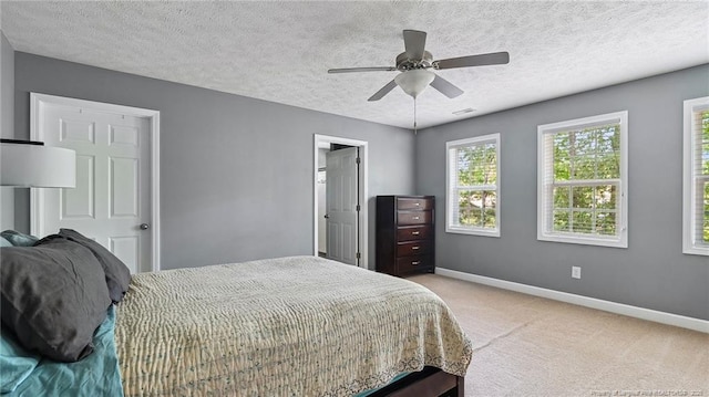 116 Argyll Ave, Aberdeen, NC 28315 - bedroom with carpet floors, baseboards, a textured ceiling, and a ceiling fan