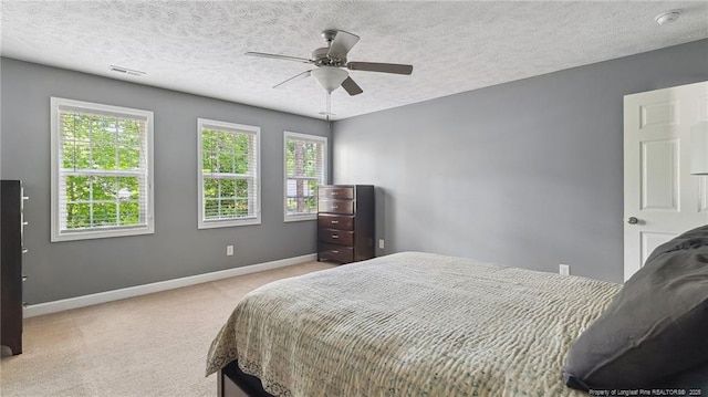 116 Argyll Ave, Aberdeen, NC 28315 - carpeted bedroom with baseboards, a ceiling fan, and a textured ceiling