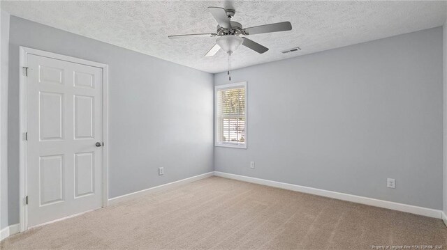 116 Argyll Ave, Aberdeen, NC 28315 - unfurnished room with ceiling fan, carpet floors, baseboards, and a textured ceiling
