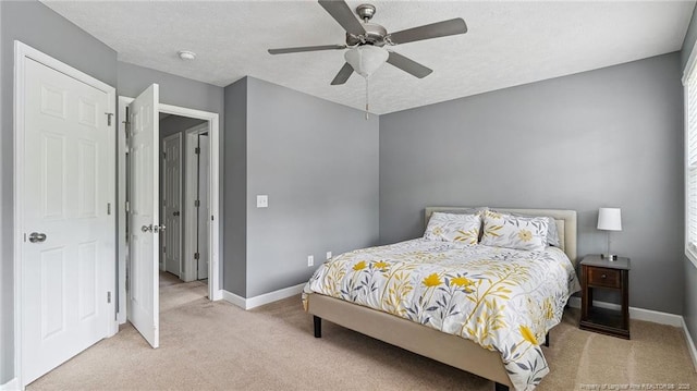 116 Argyll Ave, Aberdeen, NC 28315 - bedroom with light carpet, baseboards, and ceiling fan