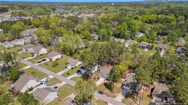 116 Argyll Ave, Aberdeen, NC 28315 - aerial view of property and surrounding area featuring nearby suburban area and a heavily wooded area