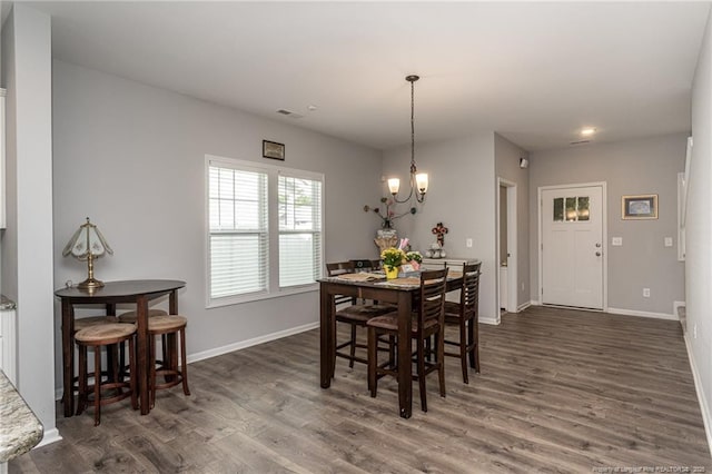 dining room featuring dark wood-style floors, a chandelier, baseboards, and recessed lighting