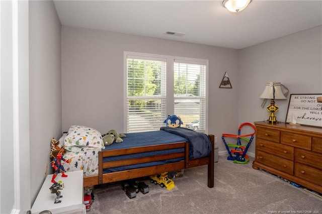 bedroom featuring carpet flooring and baseboards