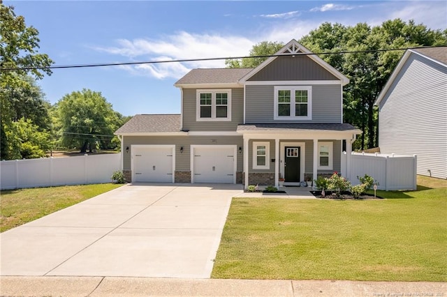 craftsman-style home featuring driveway, covered porch, and roof with shingles