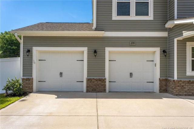 garage with concrete driveway