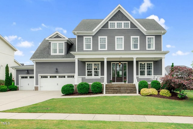 view of front of home featuring a porch, driveway, a front yard, and a shingled roof
