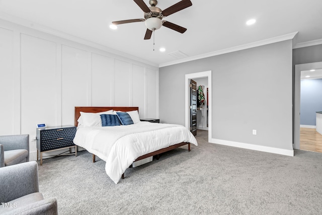 bedroom featuring ornamental molding, recessed lighting, carpet floors, a walk in closet, and baseboards