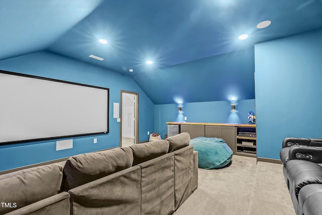 carpeted home theater room featuring lofted ceiling, recessed lighting, and baseboards