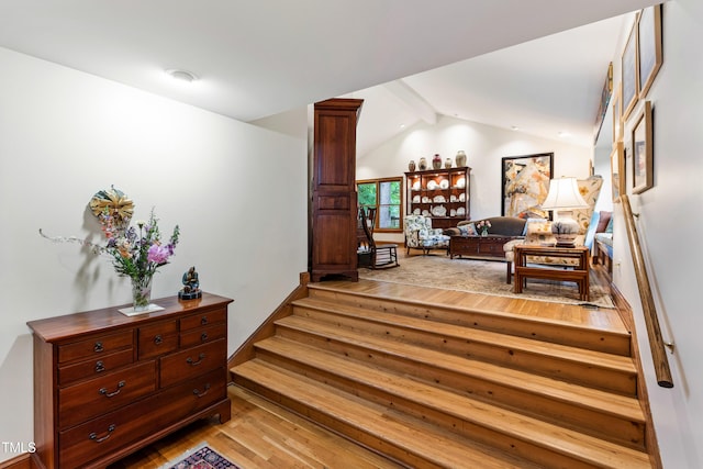 corridor featuring light wood-style floors and stairs