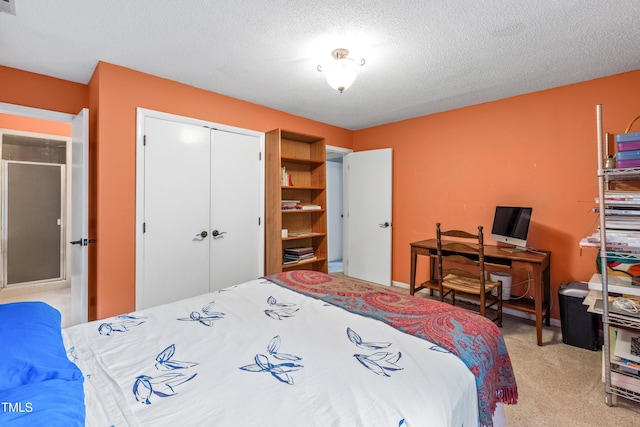 bedroom featuring light carpet, a closet, and a textured ceiling