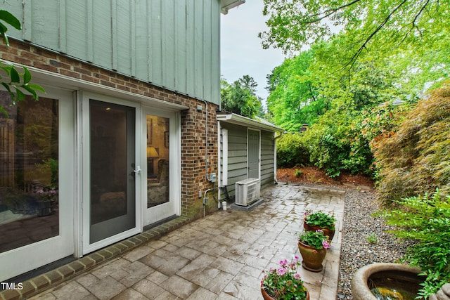 view of patio / terrace featuring french doors and a cooling unit