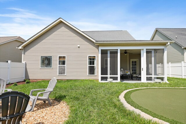 13 Nettletree Creek Ct, Youngsville, NC 27596 - back of house with an area to practice putting, a sunroom, ceiling fan, and a patio