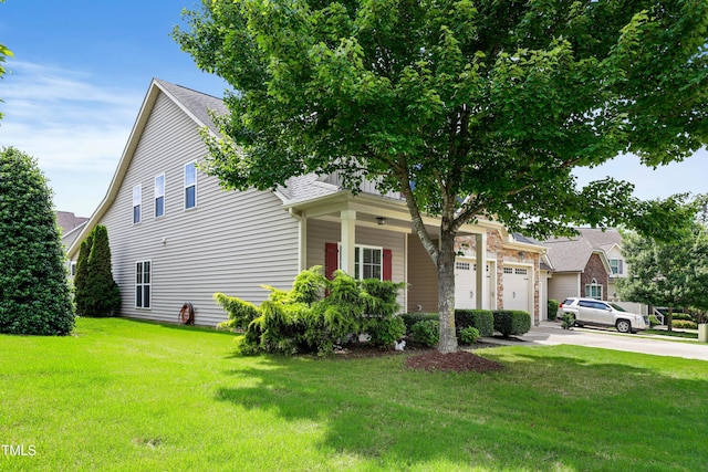 13 Nettletree Creek Ct, Youngsville, NC 27596 - view of front facade with driveway, a front lawn, a garage, and a shingled roof