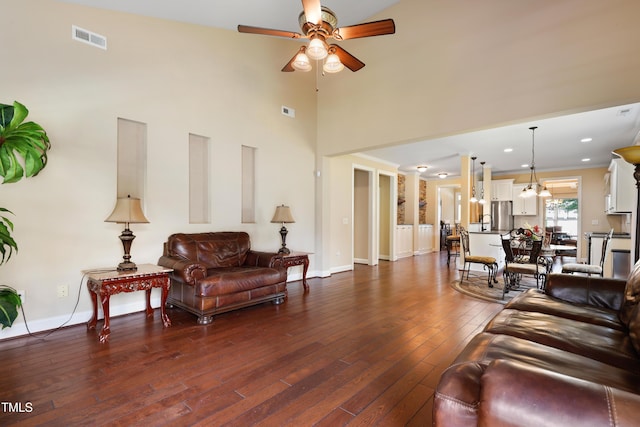 13 Nettletree Creek Ct, Youngsville, NC 27596 - living room featuring ceiling fan, dark wood-type flooring, baseboards, and a high ceiling