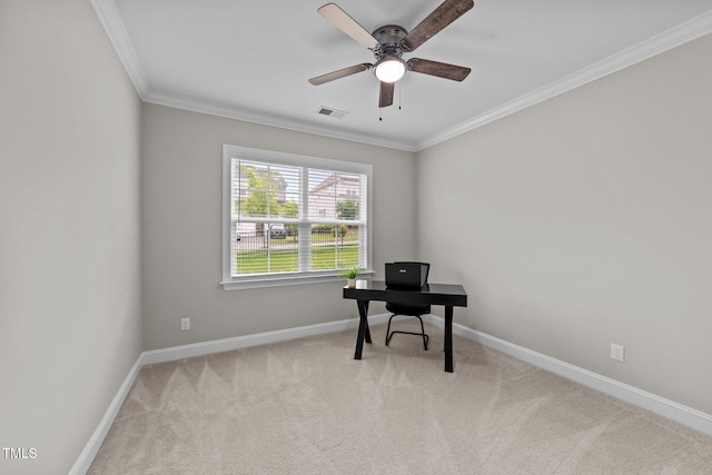 carpeted home office featuring ceiling fan, ornamental molding, and baseboards