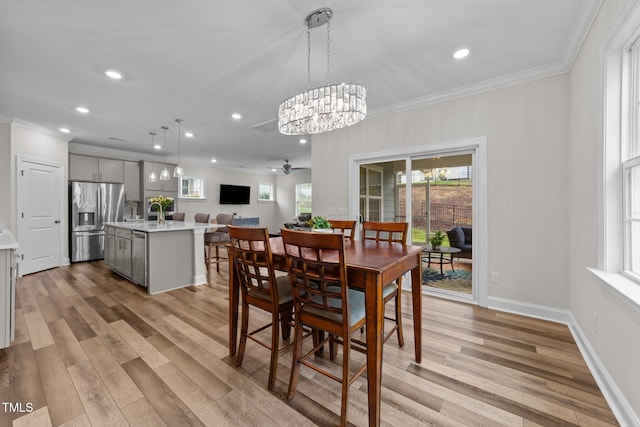 dining space featuring recessed lighting, ceiling fan, light wood-type flooring, crown molding, and baseboards