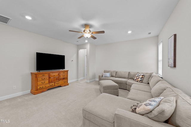 living room featuring a ceiling fan, light carpet, recessed lighting, and baseboards