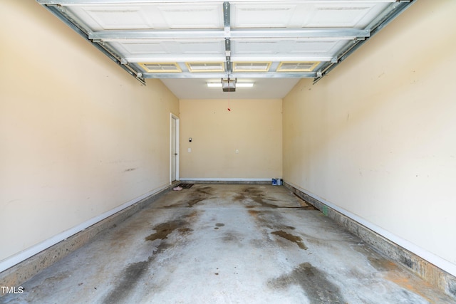 2635 Asher View Ct, Raleigh, NC 27606 - garage featuring a garage door opener and baseboards