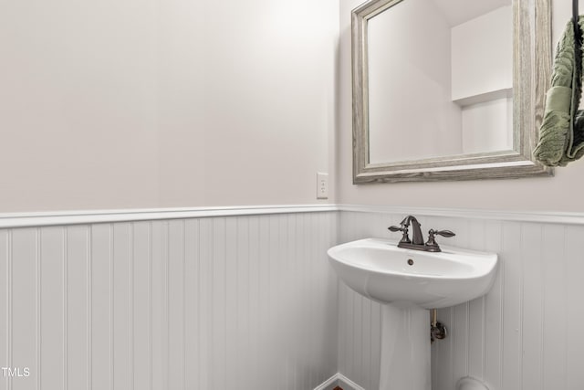 2635 Asher View Ct, Raleigh, NC 27606 - bathroom with wainscoting and a sink