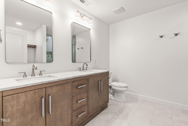 2635 Asher View Ct, Raleigh, NC 27606 - bathroom with double vanity, toilet, and baseboards