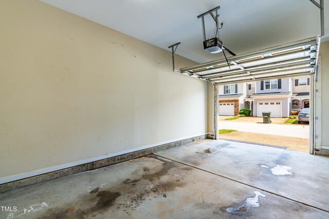 2635 Asher View Ct, Raleigh, NC 27606 - garage featuring a garage door opener and baseboards
