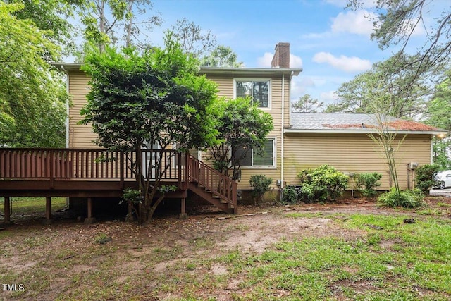 4812 Kaplan Dr, Raleigh, NC 27606 - back of house featuring a deck, a chimney, and stairway