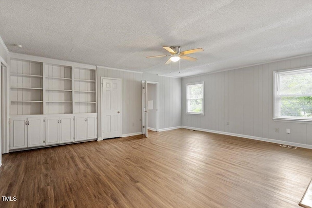 4812 Kaplan Dr, Raleigh, NC 27606 - empty room with wood finished floors, a textured ceiling, ceiling fan, and baseboards