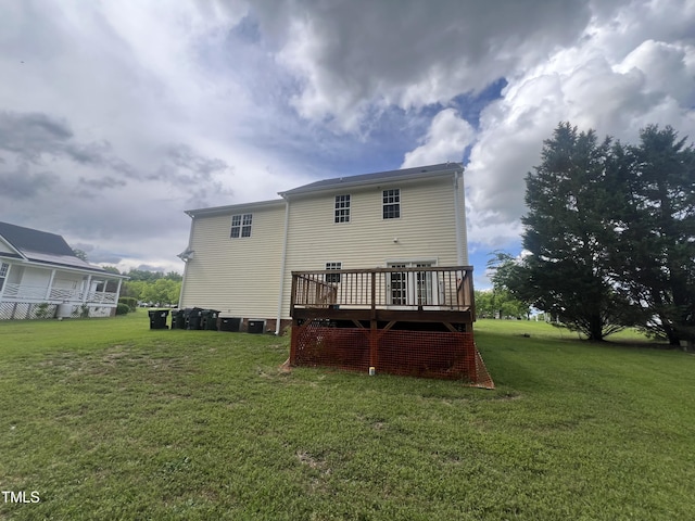 2377 Vinson Rd, Clayton, NC 27527 - rear view of house featuring a wooden deck and a lawn