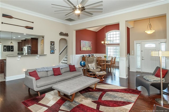 4222 Dock View Rd, Fayetteville, NC 28306 - living area with ornamental molding, dark wood-type flooring, stairs, ceiling fan, and a wainscoted wall