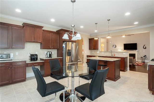 4222 Dock View Rd, Fayetteville, NC 28306 - kitchen featuring stainless steel fridge, arched walkways, open floor plan, backsplash, and a peninsula
