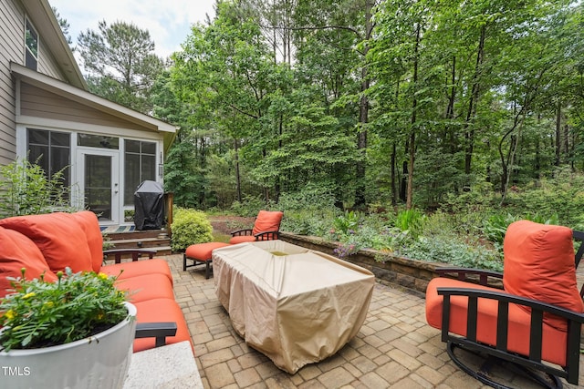 view of patio with a sunroom