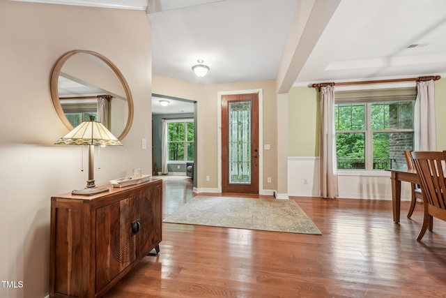 entrance foyer featuring wood finished floors and baseboards