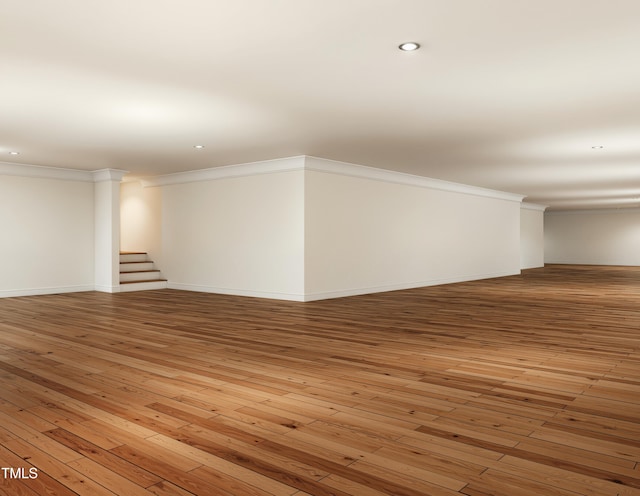 300 Westerman Pl, Smithfield, NC 27577 - empty room with crown molding, light wood finished floors, stairway, recessed lighting, and baseboards