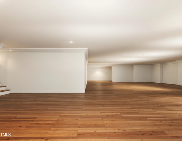 300 Westerman Pl, Smithfield, NC 27577 - empty room featuring crown molding, light wood-style floors, recessed lighting, stairway, and baseboards