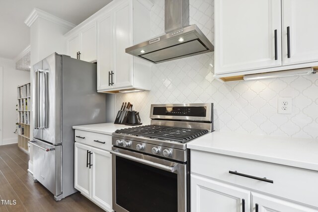 1602 Bowery Dr, Raleigh, NC 27607 - kitchen featuring appliances with stainless steel finishes, wall chimney range hood, crown molding, dark wood-type flooring, and light countertops