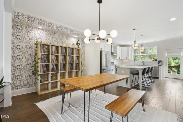 1602 Bowery Dr, Raleigh, NC 27607 - dining area featuring ornamental molding, wallpapered walls, baseboards, wood-type flooring, and recessed lighting